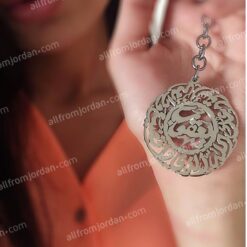 Round keychain with prayer for safety and custom made name.