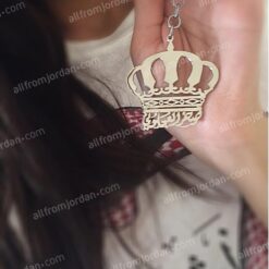 Crown keychain with custom made name at the bottom.